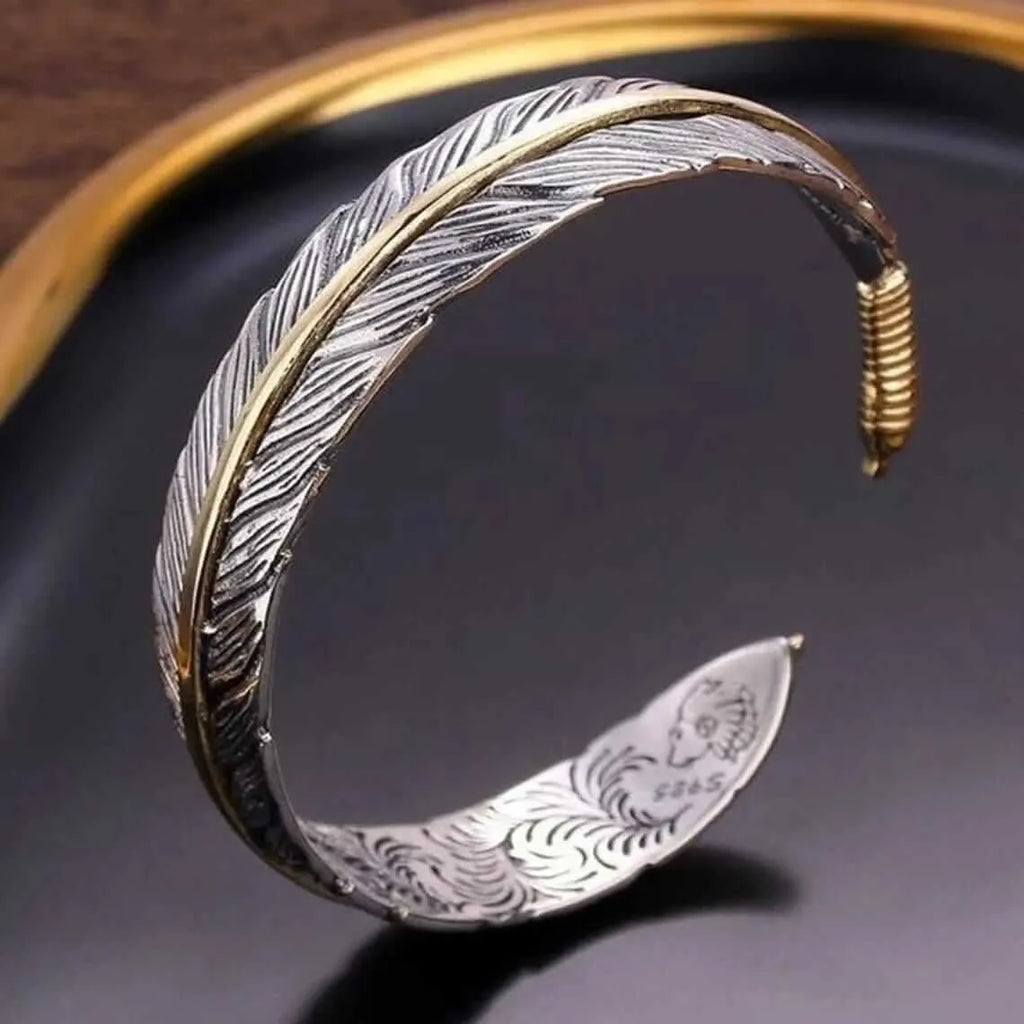 Pulsera Aleación Ajustable Pluma Dorada Y Plateada Calenbi