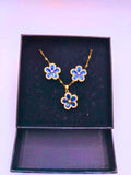 Collar y Aretes Acero Inoxidable Flor Azul Chapa Oro 10k Calenbi