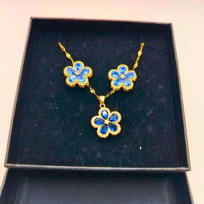 Collar y Aretes Acero Inoxidable Flor Azul Chapa Oro 10k Calenbi